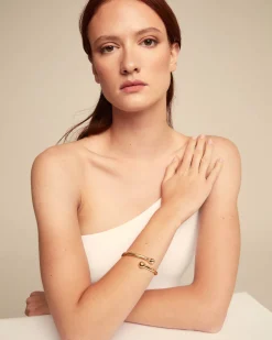 Bangle bracelet with inner spring