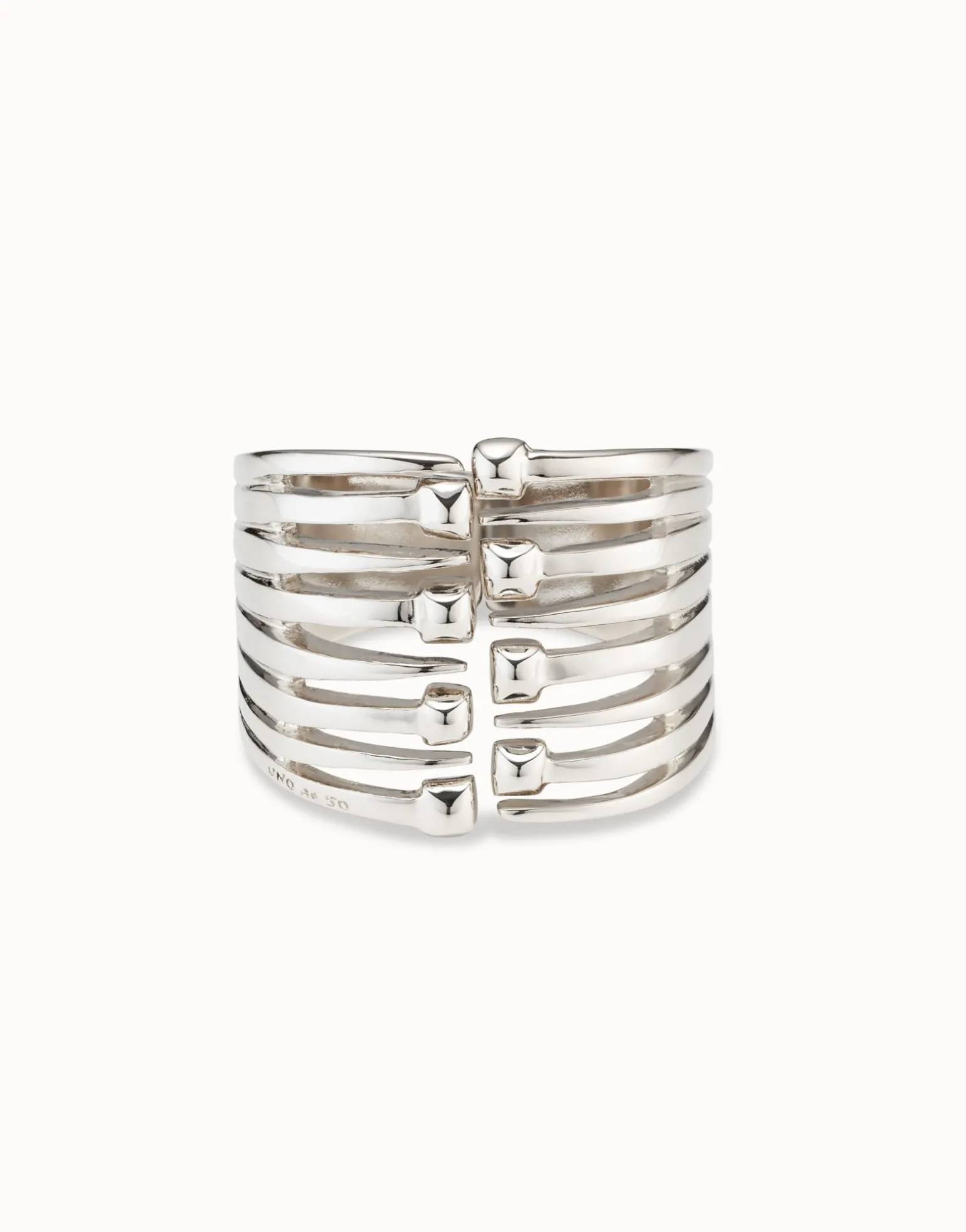 Bangle bracelet with multiple nail heads