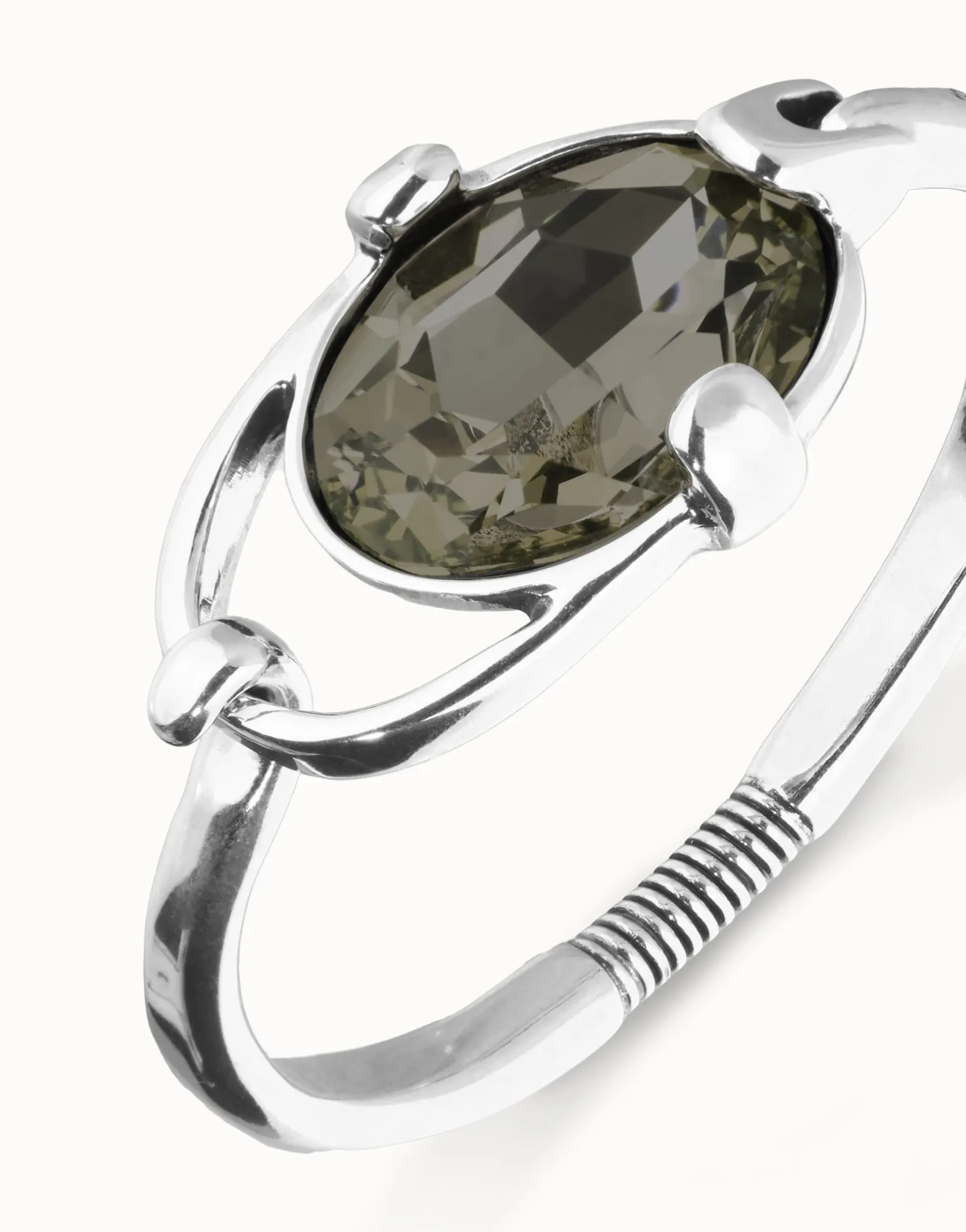 Bangle bracelet with oval faceted gray crystal