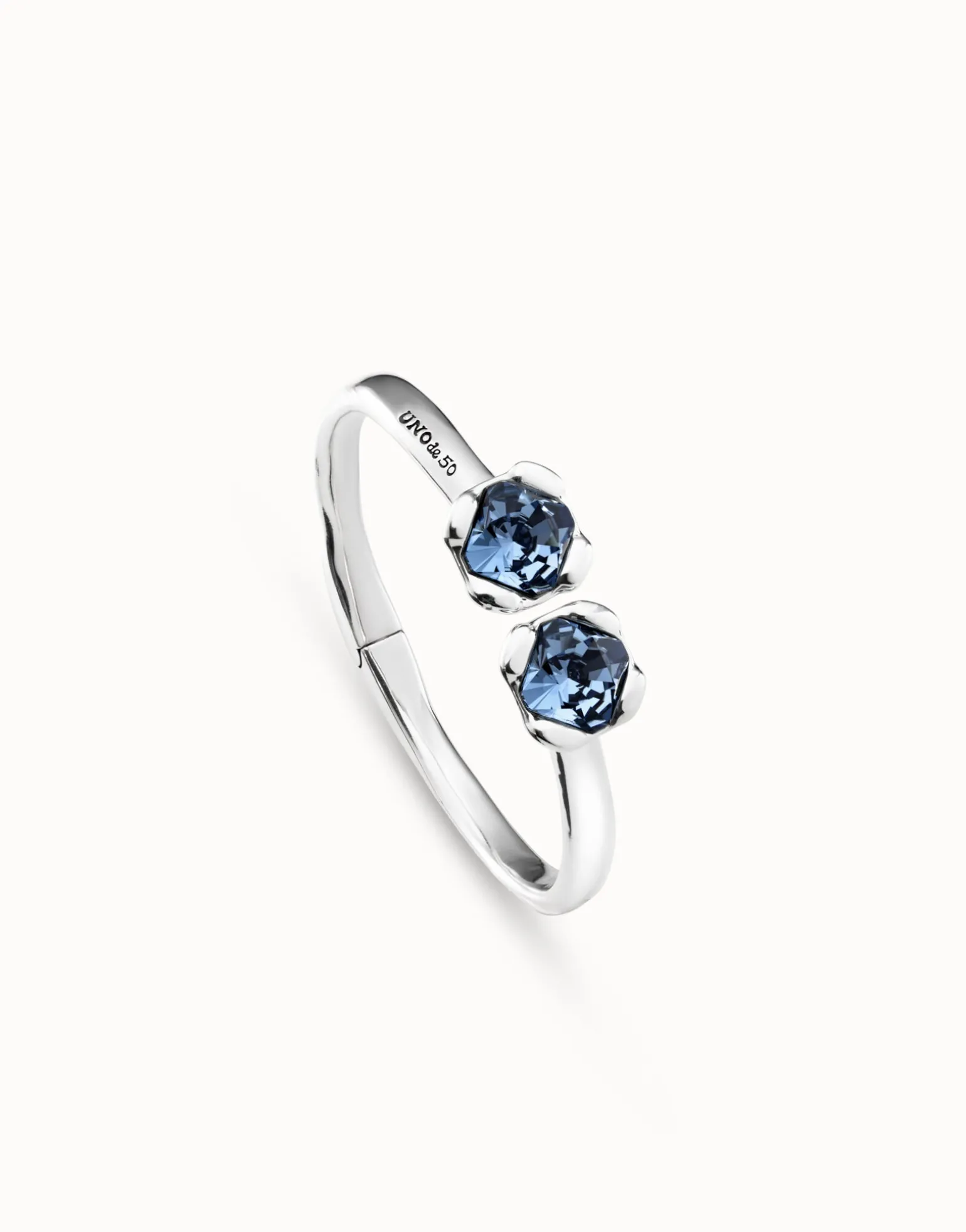 Bangle bracelet with two blue crystals