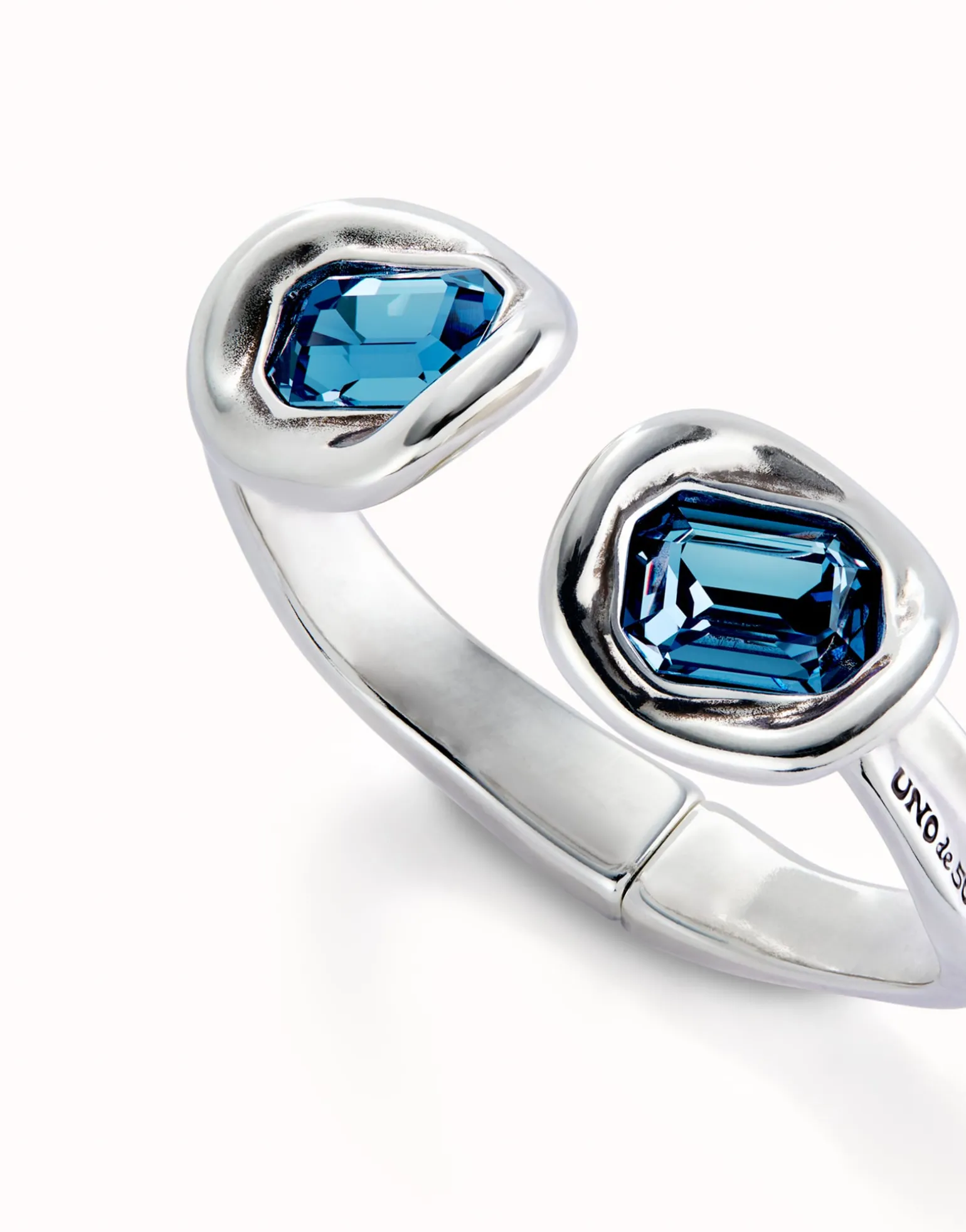 Bangle bracelet with two blue crystals