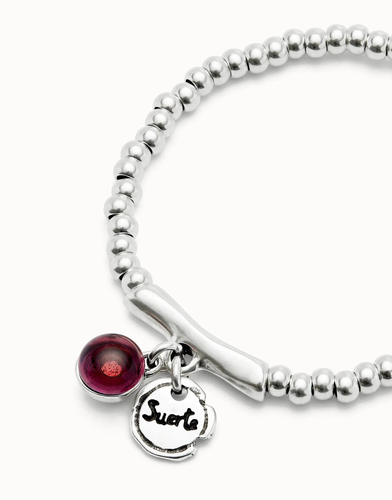Beaded stretch bracelet with a murano glass and the word lucky