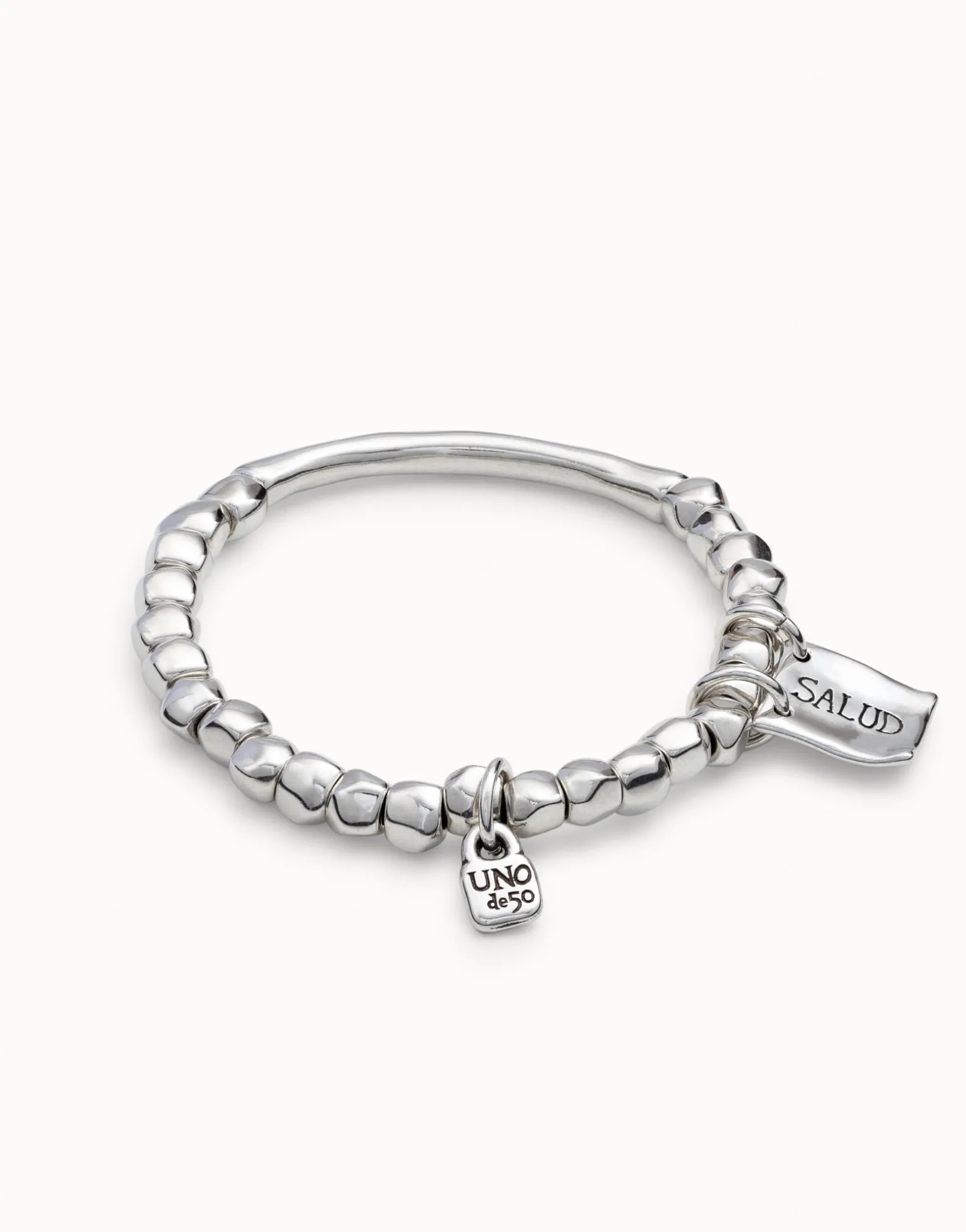 Beaded stretch bracelet with tubular piece and charms