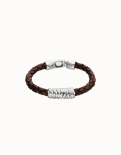 Brown braided leather bracelet with a metal detail