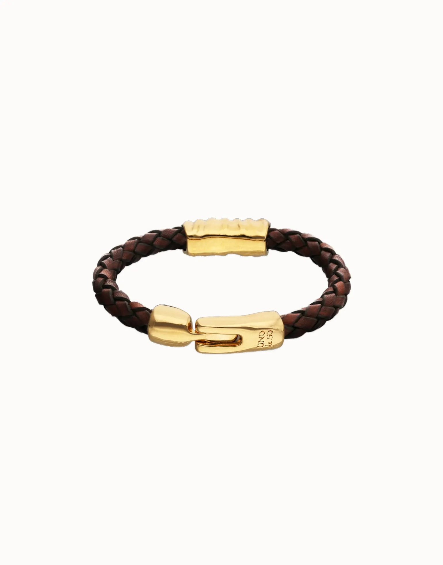 Brown braided leather bracelet with a metal detail
