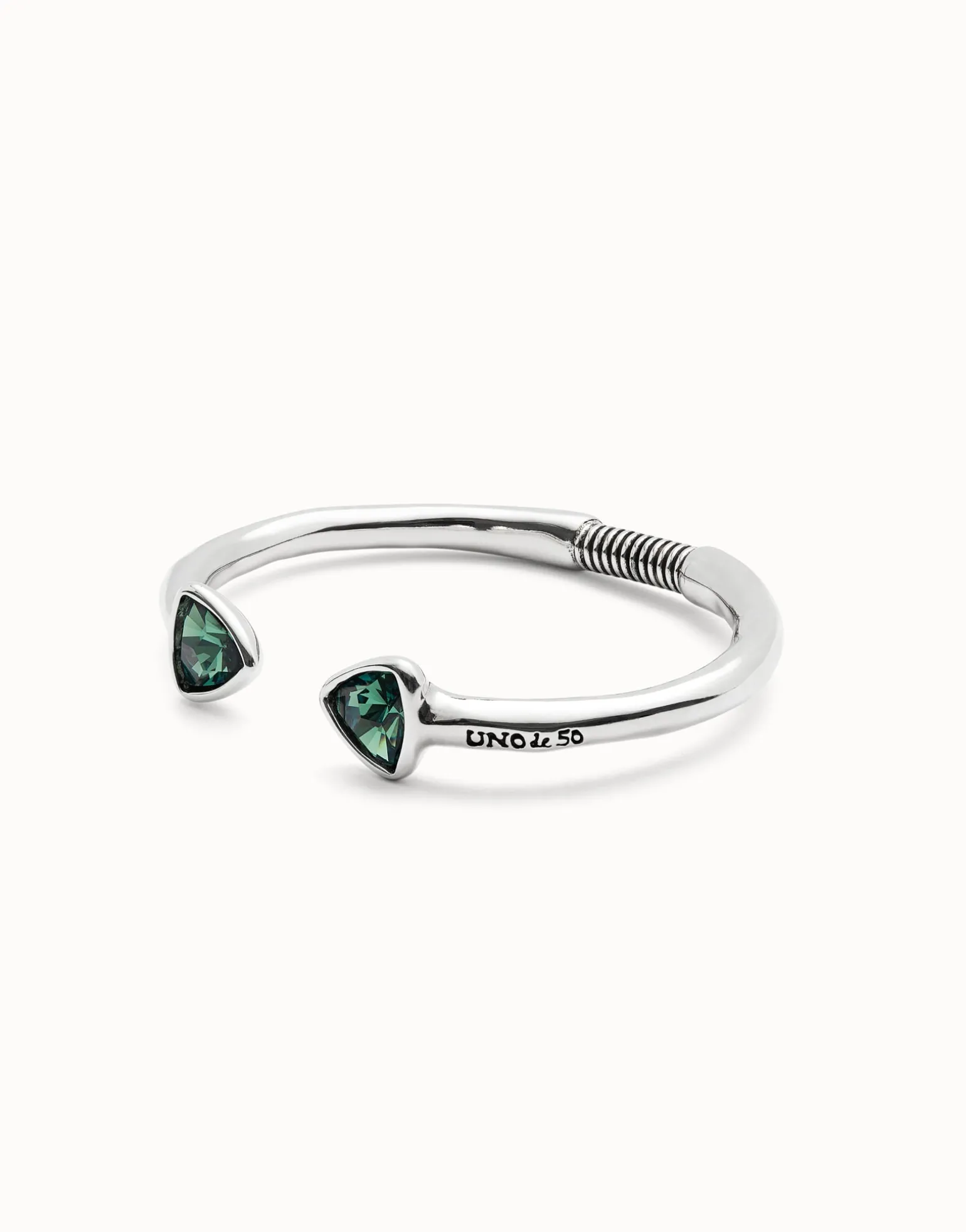 Cuff bracelet with two green crystals