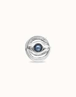 Eye-shaped ring with faceted blue crystal