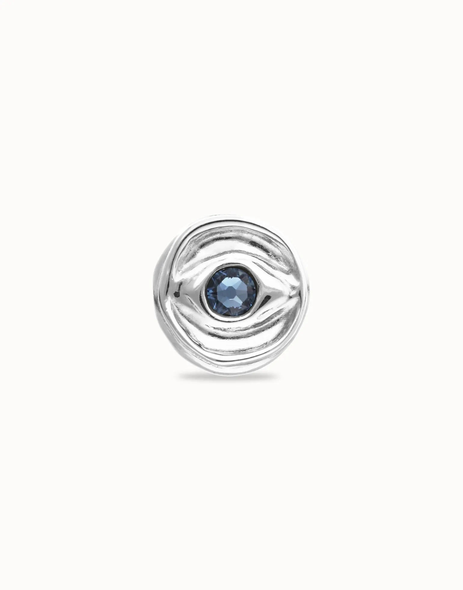 Eye-shaped ring with faceted blue crystal