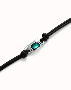 Leather bracelet with a green crystal