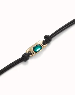 Leather bracelet with a green crystal