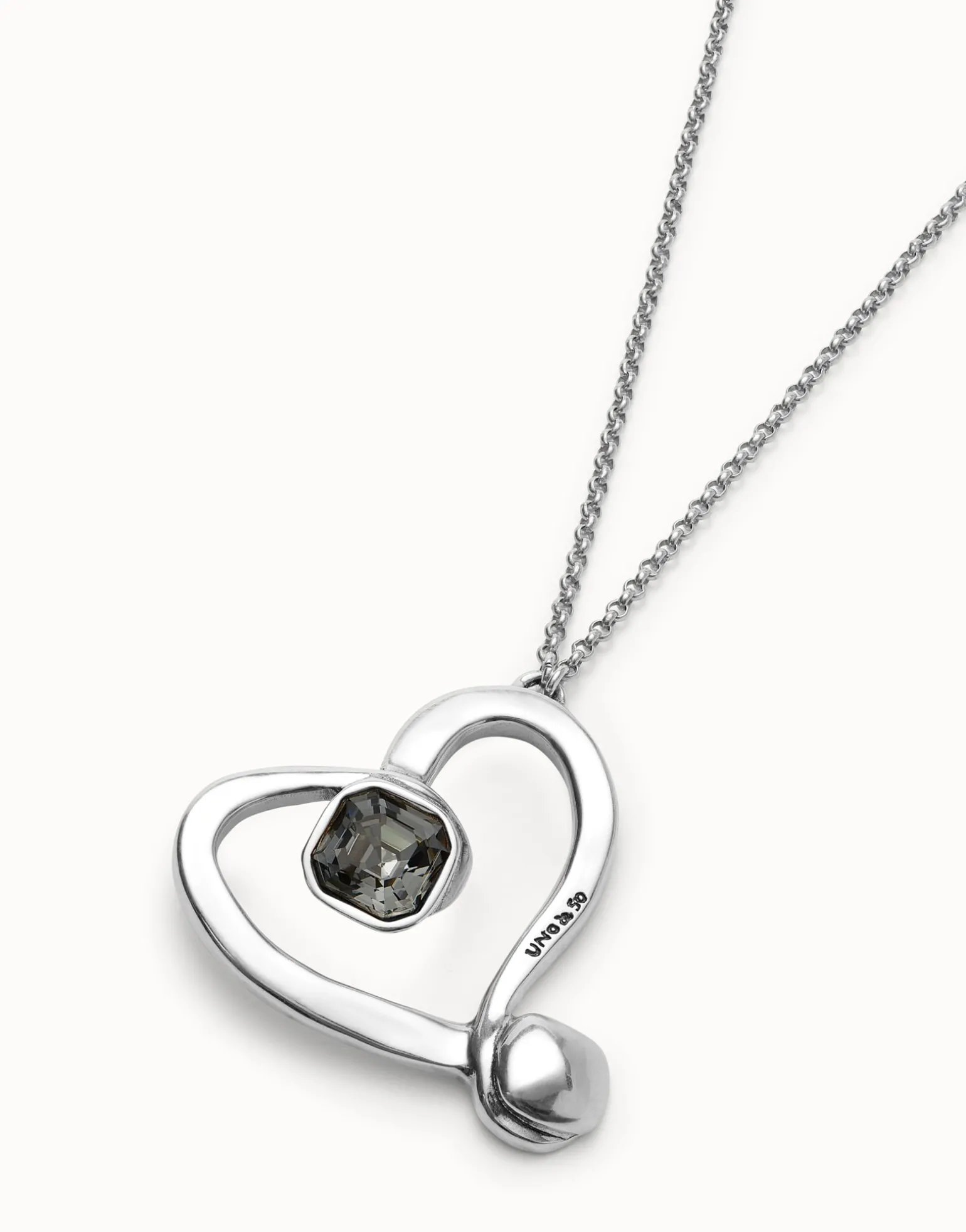 Long chain pendant necklace with a large heart