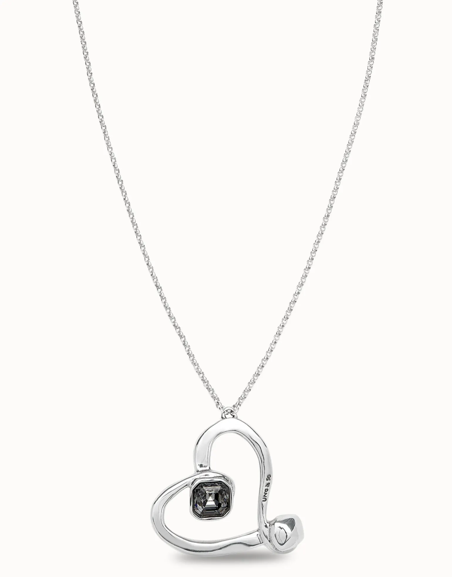 Long chain pendant necklace with a large heart
