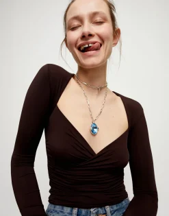 Long necklace with large blue oval faceted crystal