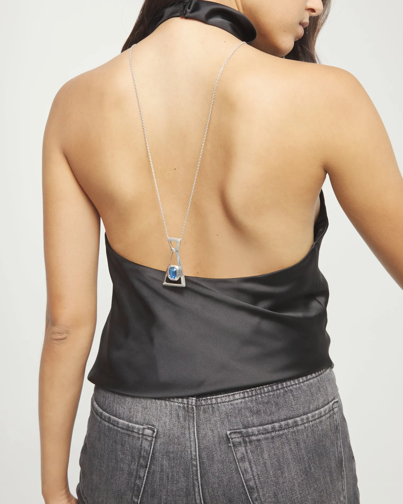 Long necklace with pendant and rectangular blue faceted crystal