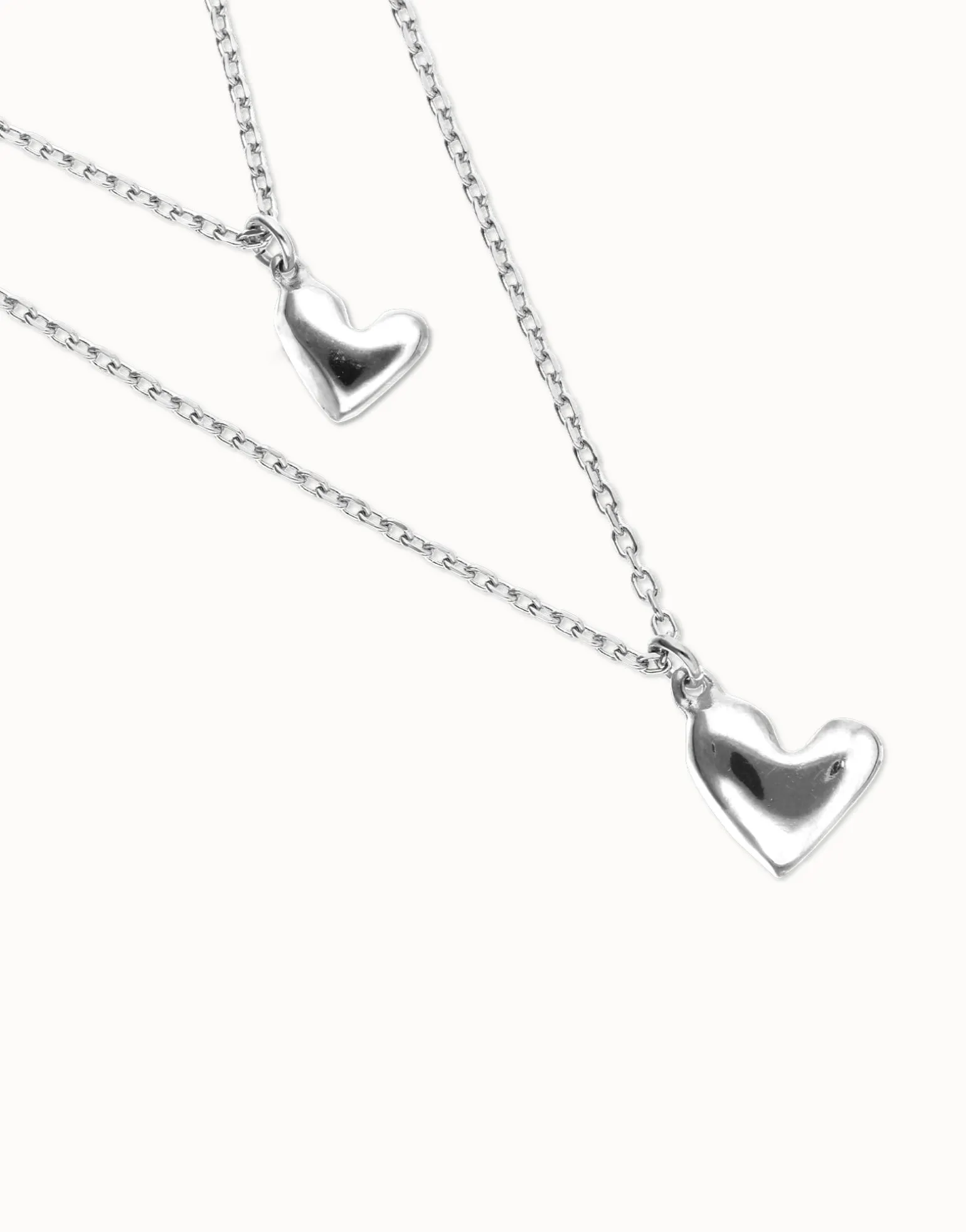 Multi strand chain necklace with two hearts