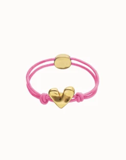 Pink elastic thread bracelet with heart charm